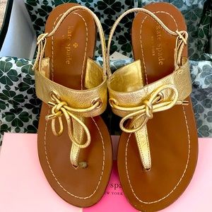 Pretty never worn Kate Spade Gold leather sandals. In box.